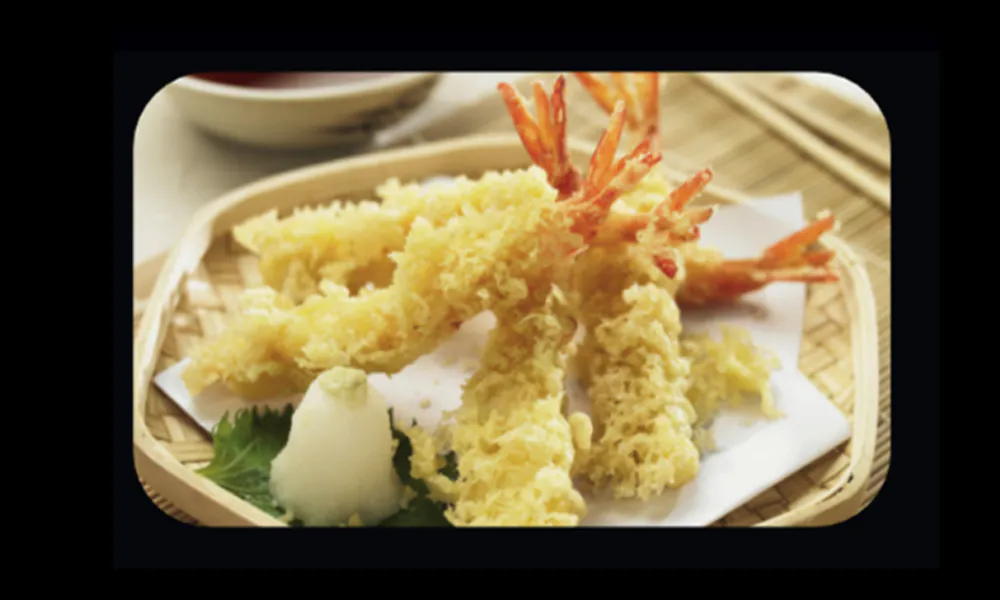 Golden crispy shrimp tempura with light batter and classic dipping sauce at Hungry Bowl Mongolian Grill, Sushi & KBBQ, a Asian Restaurant in Leominster