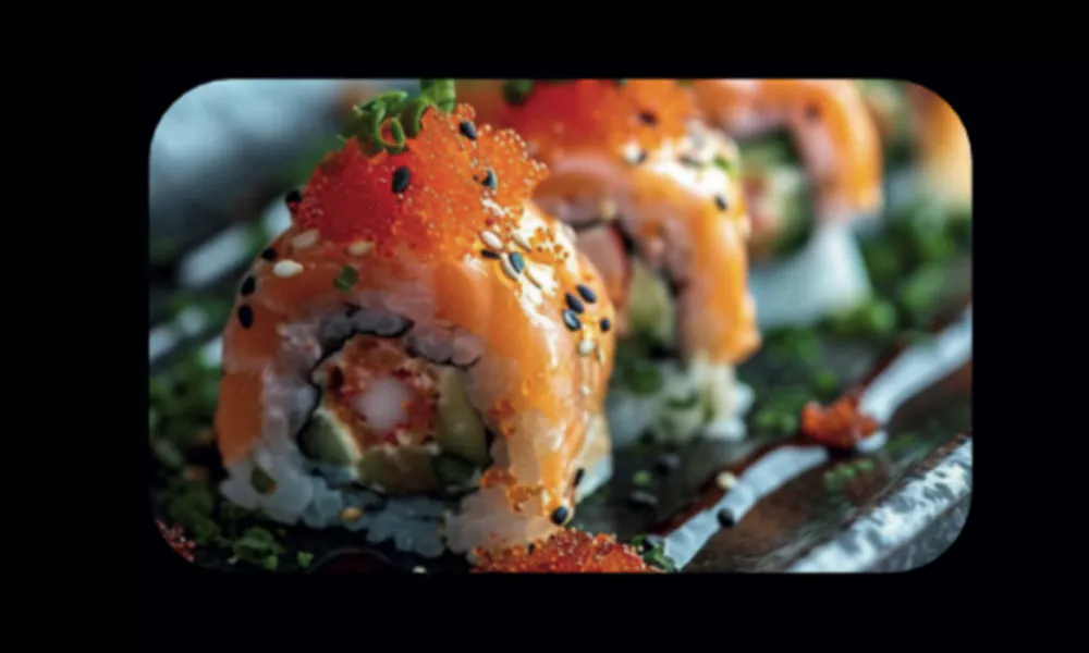 Rich salmon maki roll topped with tobiko, sesame and savory sauce at Hungry Bowl Mongolian Grill, Sushi & KBBQ, a Asian Restaurant in Leominster